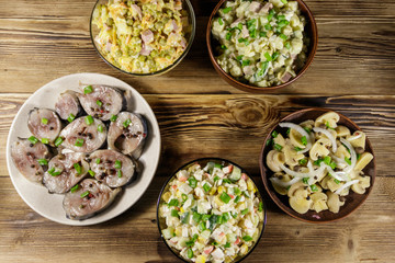 Various festive dishes on wooden table