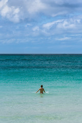 Fototapeta na wymiar Girl in a bikini on the sea