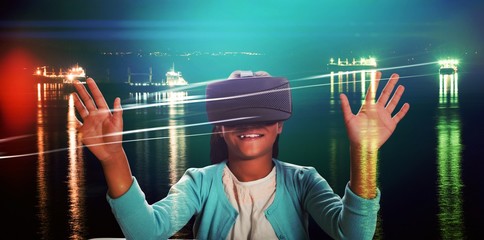 Composite image of black girl with virtual reality glasses