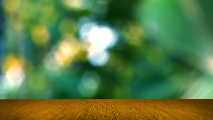 Wooden floor with Abstract green nature blurred background