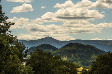 Mountain landscape, Karkonosze Mountains with clouds in the background.