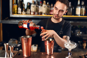 Bar. Bartender Making Cocktails, Measuring Alcohol