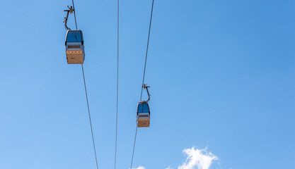 cableway against the sky, transport at height and tourist attraction