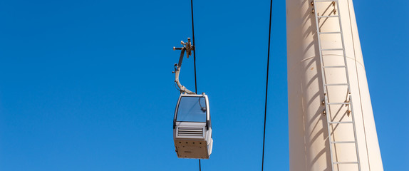 cableway against the sky, transport at height and tourist attraction