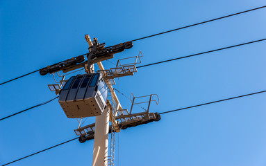 cableway against the sky, transport at height and tourist attraction