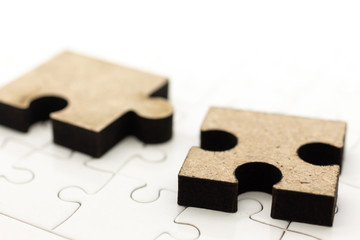 Jigsaw puzzle piece on the jigsaw board, image use for solving problems, background concept.