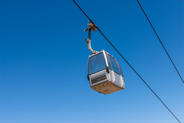 cableway against the sky, transport at height and tourist attraction
