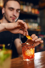 Cocktail. Bartender Preparing Cocktail In Bar 