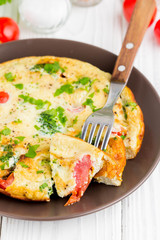 Omelet with broccoli and tomato, delicious healthy Breakfast, traditional morning food