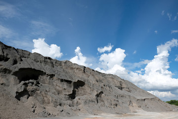 Pile of stones for construction isolated on blue sky background