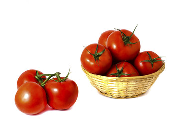 red ripe tomatoes in a basket on a white background