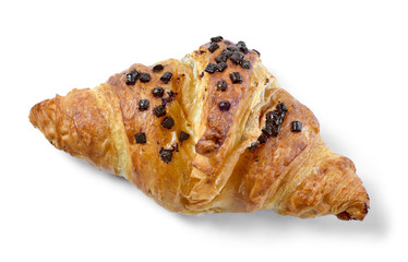 Delicious french chocolate croissant or butter croissant with chocolate filling and  chocolate crumbles. Fresh croissant, top view, isolated on white background.