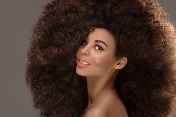 Beauty portrait of attractive woman in afro hairstyle.