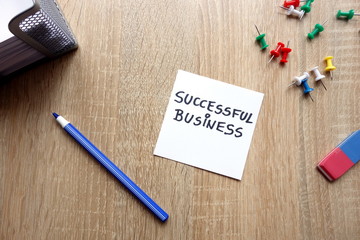 Successful business concept with message on wooden table