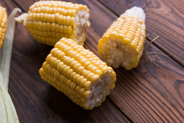 Fresh sweet corn on table