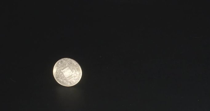 2018 Bitcoin Token spinning in slow motion on a black background