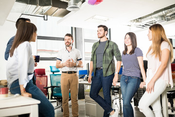 Business team chatting in coffee break