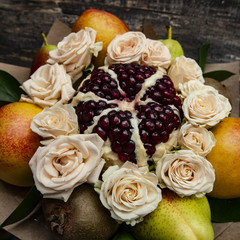 composition of fresh bright fruit and Bush rose