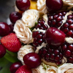 composition of fresh bright fruit and Bush rose