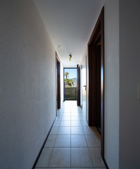 Corridor with entrance and open door