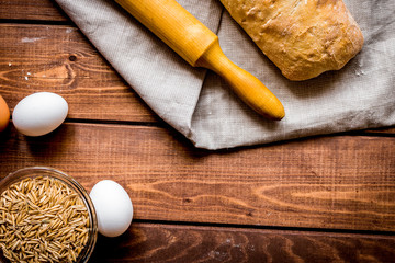 bakery concept with homemade bread on rustic background top view