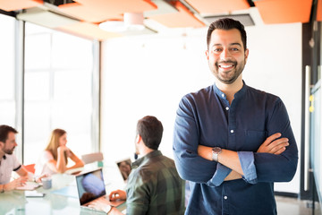 Latin man in casual clothing at startup meeting room
