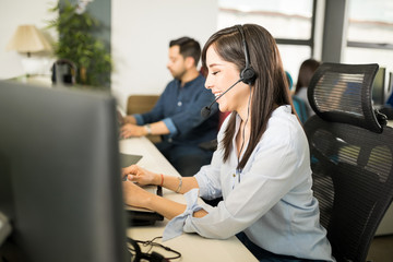 Business woman taking calls from customers