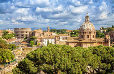 Fototapeta na wymiar Aerial scenic view of Colosseum, Roman Forum and church of Santi Luca e Martinain in Rome, Italy. Rome architecture and landmark.