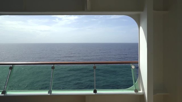 Ocean view from a cruise liner balcony state room - sliding shot