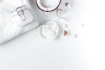 Fototapeta na wymiar organic cosmetics with coconut on white background top view mock