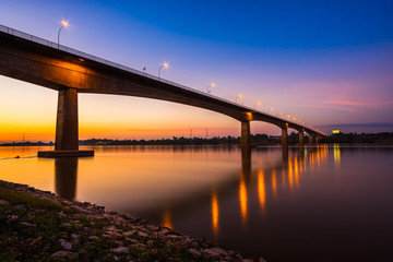 Fototapeta na wymiar Thai-Laos Friendship Bridge on sunset background