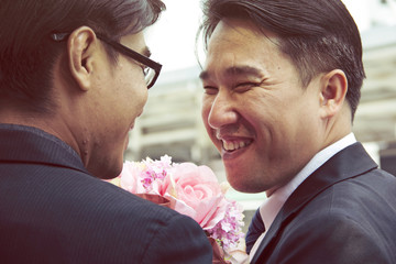 Male same sex lover couple smile and happy.