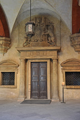 Fototapeta na wymiar Italy, Bologna old medieval building door in Accursio palace interior. 