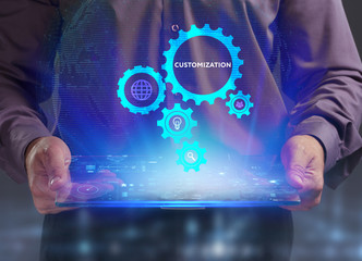 The concept of business, technology, the Internet and the network. A young entrepreneur working on a virtual screen of the future and sees the inscription: Customization