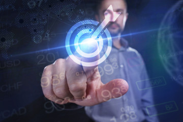 Fototapeta premium The concept of business, technology, the Internet and the network. A young entrepreneur working on a virtual screen of the future and sees the inscription: