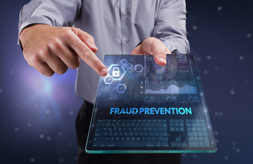 The concept of business, technology, the Internet and the network. A young entrepreneur working on a virtual screen of the future and sees the inscription: Fraud prevention