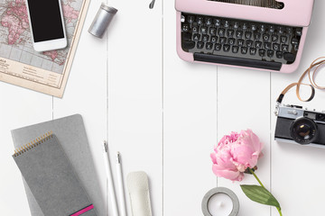 styled feminine desk background with various writing supplies, vintage camera and pink peony - top...