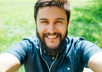 Man taking selfie in the forest