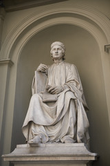 Fototapeta premium Firenze, Italy - June 21, 2018 : Arnolfo di Cambio statue in Palazzo dei Canonici