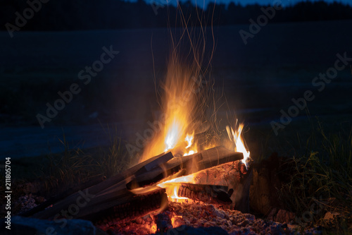 marshmallows roasting over campfire in the evening stock photo and