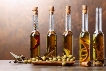Obraz premium Green olives and bottles of olive oil .