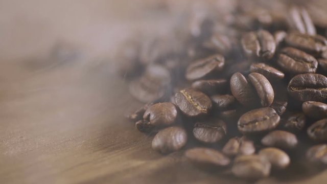 Fried coffee beans, delicious aroma, covered with smoke, roasted grain cafe flavor taste hot fresh smell morning.