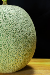 cantaloupe melon fruit on the wooden plate