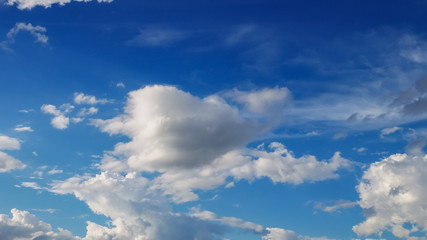 Blue sky and moving clouds.