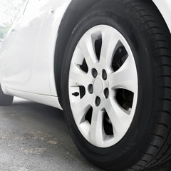 Car wheels close up on a background of asphalt. Car tires. Car wheel close-up.