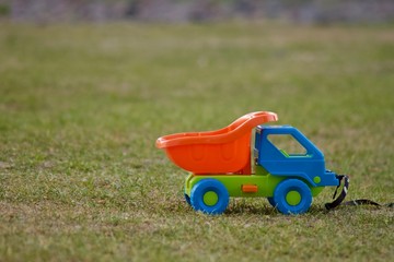 Fototapeta premium Toy car on the grass