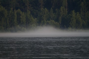 Symmetric fog over the river