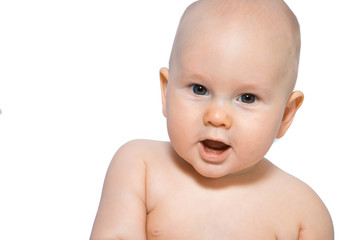 Beautiful close-up portrait of a happy baby on a uniform background