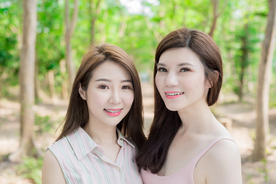 two beauty women smile happily