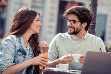 Young couple spending time in cafe together